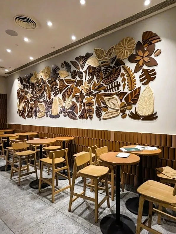 Angled view of the coffee-botanical installation at Starbucks HiLITE Mall, Kozhikode